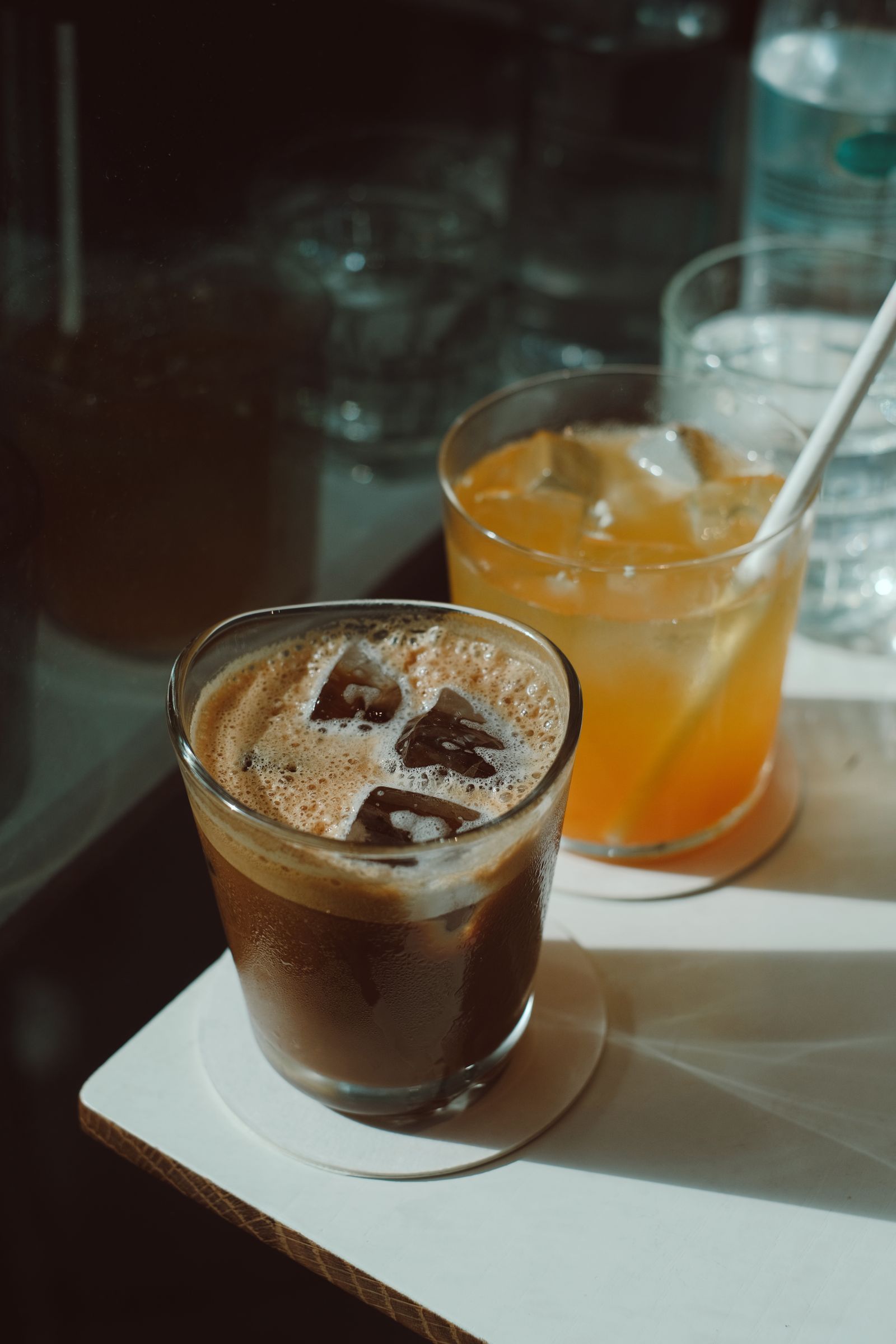 Cold brew being poured into iced lemonade